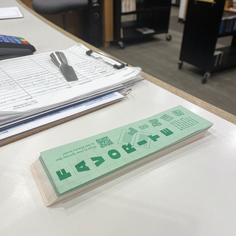stack of printed bookmarks at the Wilton Library